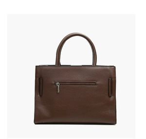 Detail of dark brown tote bag showing textured faux leather and rear zip pocket