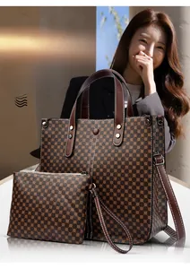Brown faux leather tote and pouch set with geometric patterns shown on a model