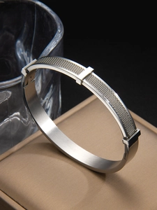 Detail of silver stainless steel mesh texture cuff bracelet on jewelry box