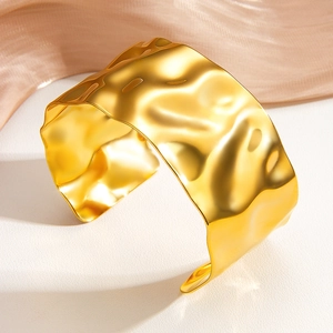 Adjustable wide 18k gold plated stainless steel cuff bracelet with hammered texture finish