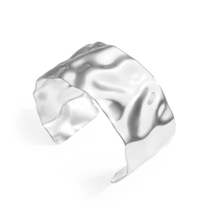 Modern wide silver cuff bracelet with irregular hammered metal texture and glossy finish