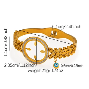 Detailed view of hollow gold sun bracelet with diamond accents and evil eye charm size specs