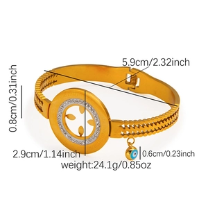 Detail of gold evil eye bangle with sparkling crystals and precise size measurements