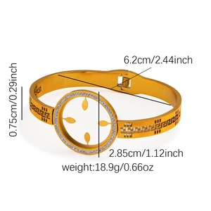 Detailed dimensions of gold bangle featuring Greek key pattern and rhinestone sun motif