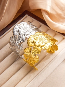 Detailed relief of vintage floral patterns on gold and silver titanium steel bracelets