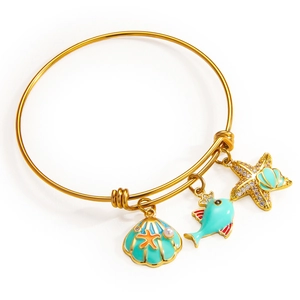 Adjustable gold ocean charm bracelet with starfish, seashell, and small fish pendants