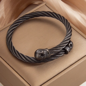 Gunmetal skull cable bracelet for men featuring a twisted stainless steel wire design