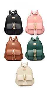 Detailed close-up of fashion backpacks in five colors with metal logo and stud accents