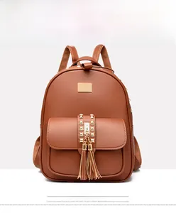 Front view of yellow-brown PU backpack featuring gold rivets and elegant long tassels