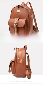 Detail view of yellow-brown PU leather backpack featuring gold studs and fringe charms