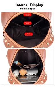 Internal view of brown leather backpack showing compartments and storage capacity