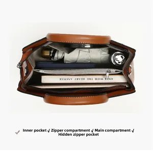 Detailed top view of the spacious leather handbag interior with multiple compartments