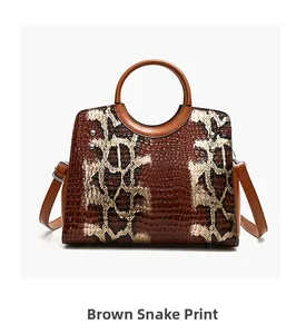 Detail showing brown faux snake and crocodile embossed leather texture on handbag