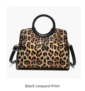 Close-up of leopard print shoulder bag featuring circular handles and silver hardware