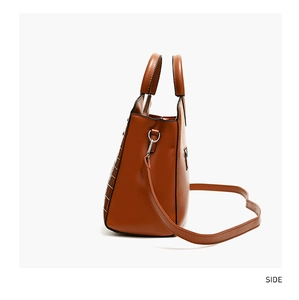 Side view of large brown shoulder bag with croc-effect texture and silver hardware