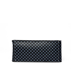 Retro black leather tote bag with blue geometric pattern and white stitching detail