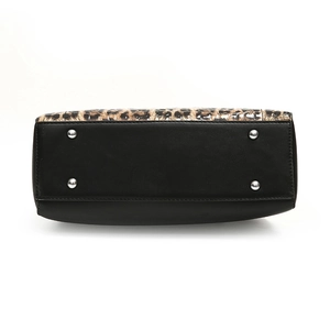 Bottom view of large leopard print tote bag with black leather base and protective metal studs
