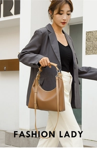 Brown leather hobo bag with pebble grain texture shown in a street style fashion shot