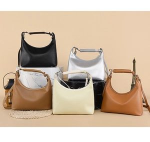 Litchi pattern leather bucket bags collection in five colors on marble display