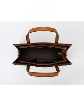 Internal layout of large tan tote bag featuring multi-compartment storage and zipper pocket