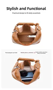 Detail view of large brown pebble leather tote showing spacious storage for daily items