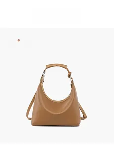 Detail view of khaki hobo bag with leather texture, wide strap and silver metal hardware