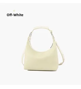 Detailed view of off-white hobo bag with litchi grain leather and silver buckle