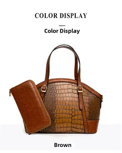 Detailed view of brown crocodile embossed tote bag and matching long zipper wallet