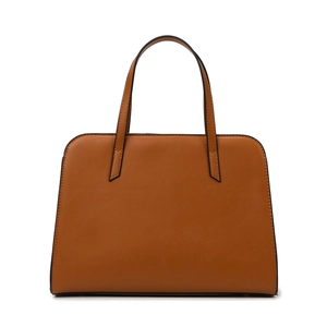 Minimalist brown faux leather tote bag with black edge piping and long handles