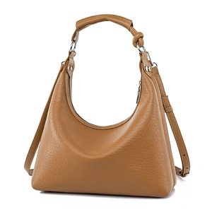 Brown leather crescent shoulder bag with pebbled texture and adjustable long strap