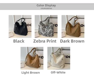 Detail view of large canvas shoulder bags with double front zippers in five assorted colors