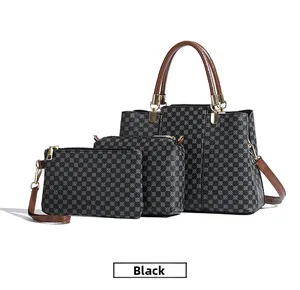 Dettaglio del set da 3 pezzi con borsa tote nera, borsa a tracolla e pochette elegante