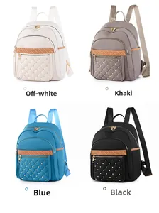 Quilted nylon backpack display in white, khaki, blue, and black with rivet details