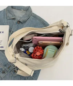 Large off-white canvas tote bag showing interior space for tablet and essentials