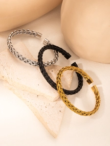 Three-piece set of woven titanium steel bracelets in gold, silver, and black finishes