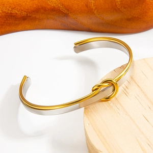 Two-tone knot adjustable stainless steel cuff bracelet in gold and silver finish
