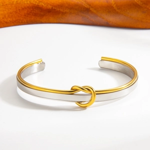 Adjustable two-tone knot cuff bracelet in polished PVD 18K gold and silver steel