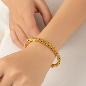 Elegant 18k gold PVD plated woven titanium steel adjustable bangle for women on wrist