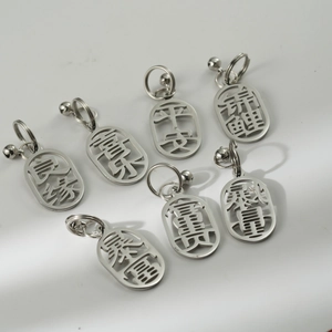 Detailed view of 7 stainless steel charms with Chinese calligraphy and small bells