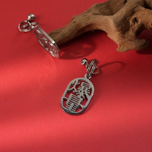 304 stainless steel earrings with cutout Chinese characters for wealth and red backdrop