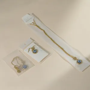 Macro de pendentif œil maléfique en acier inoxydable doré avec zircon bleu et emballage