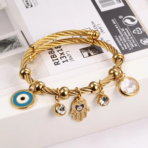 Adjustable 18K gold cable bracelet with Hamsa Hand and Evil Eye charms and crystals