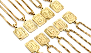 Macro view of gold 18K plated stainless steel initial necklaces with A-J letter pendants