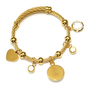 Detailed close-up of gold cable wire bracelet with heart and crystal charms
