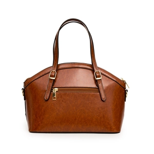 Brown crocodile embossed handbag with gold hardware and dual top handles on white background
