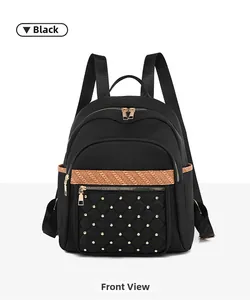 Front view of black quilted Oxford fabric backpack with gold studs and woven strap detail