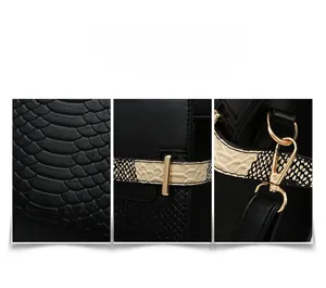 Detail of black faux leather texture with snakeskin pattern and gold-tone hardware