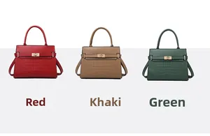 Detail of red, khaki, and green handbags with faux crocodile leather texture and metal locks