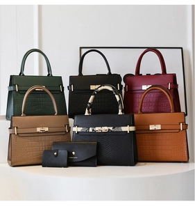 Collection of faux crocodile texture tote bags with gold metal rotating locks and top handles
