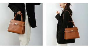 Close-up of caramel brown handbag featuring crocodile texture and golden metal twist lock